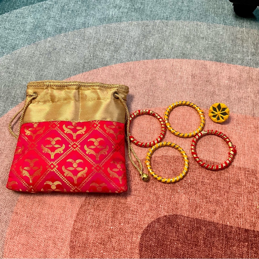 Red and Gold Drawstring Bag with Bangles and ring